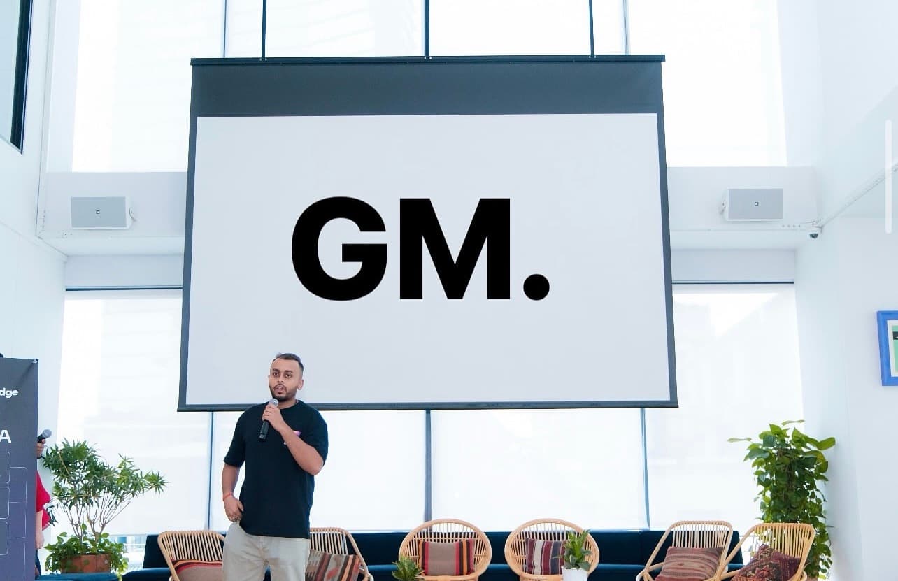 Ayush speaking at a LayerEdge event in front of a GM. slide