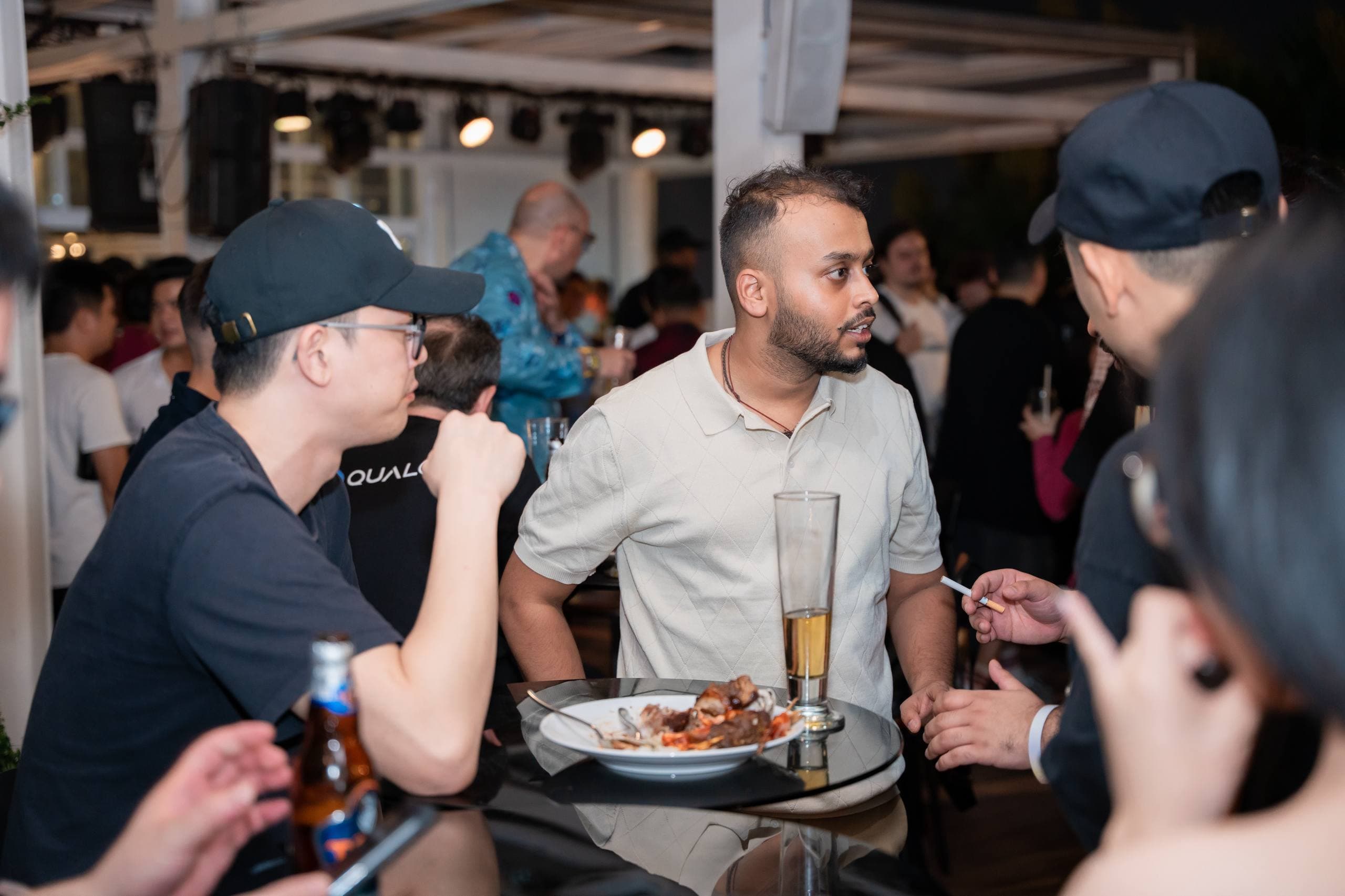 Ayush talking with people at an industry event